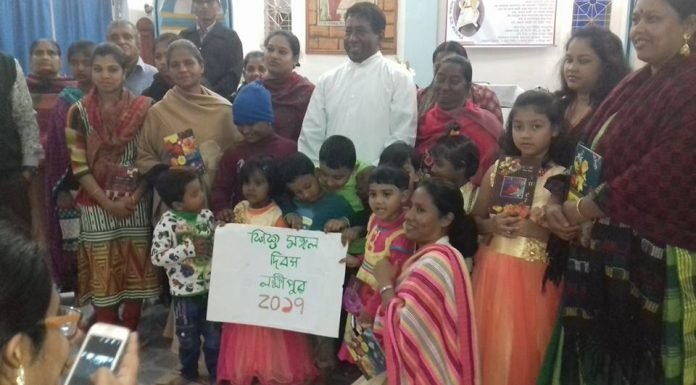 Fr. Robert Gonsalves with Children of Shahebganj