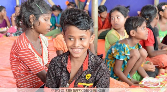 A smiling Rohingya child during the 'share a meal' campaign